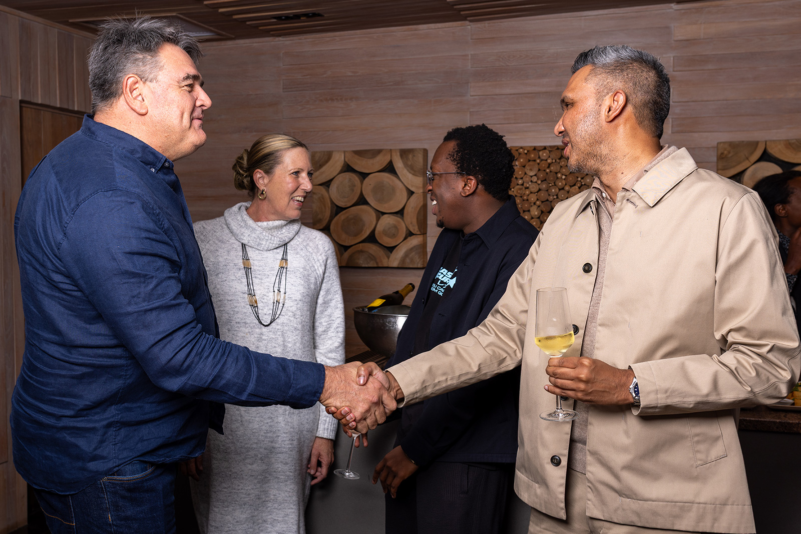 Candid executive conversation photographed by IyanaT Production at Paystack Four Seasons dinner
